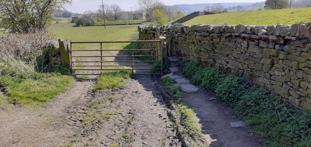 Stile into field from farm track
